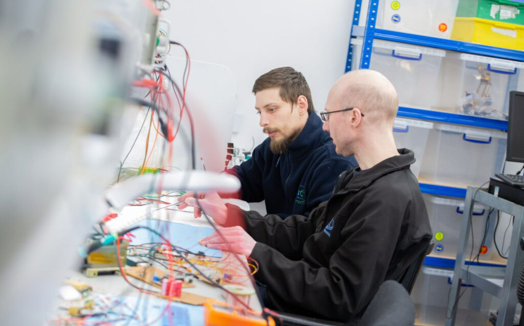Aceon engineers working in custom battery design lab
